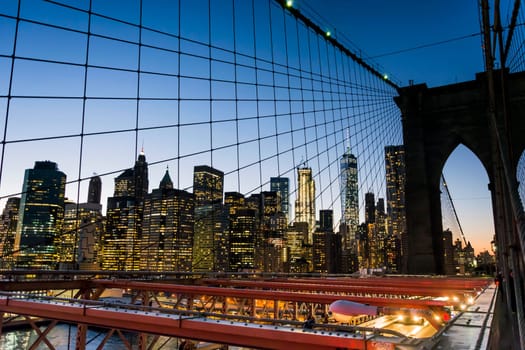 New York skyline from Brooklyn bridge at sunset