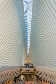 New York, USA, november 2016: People stand on a balcony looking at the stunning interior of Santiago Calatrava's Oculus, Fulton Street Station, in lower Manhattan.