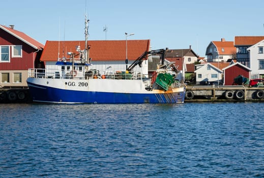 one big fishing boat in the harbour on a little island outside Gothenburg ready to go out and fish