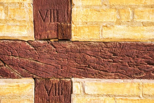 Detail of cracked painted oak timber European-known style, half-timbered building