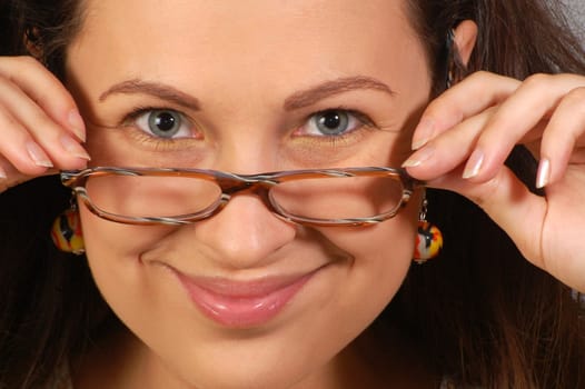 Portrait about smiling woman in glasses with hands.
