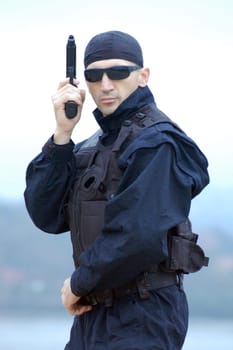 Security man with gun.