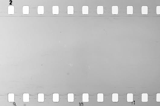 Old celluloid film strip with dust and scratches