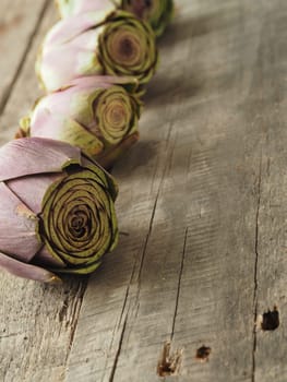 Healthy food concept with organic vegetables on a rustic wooden table, natural light with selective focus