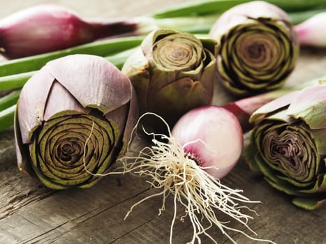 Healthy food concept with organic vegetables on a rustic wooden table, natural light with selective focus