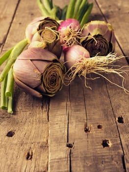Healthy food concept with organic vegetables on a rustic wooden table, natural light with selective focus, vintage color toned