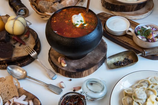 Russian borsch at pot on the table