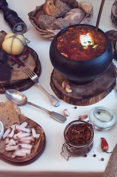 Russian borsch at pot on the table
