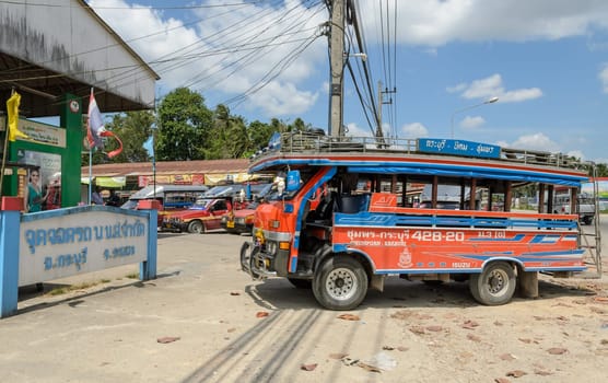 RANONG , THAILAND - FEBRUARY 20, 2015 : Public transport of wooden minibus or Songtaew in Ranong, Thailand.