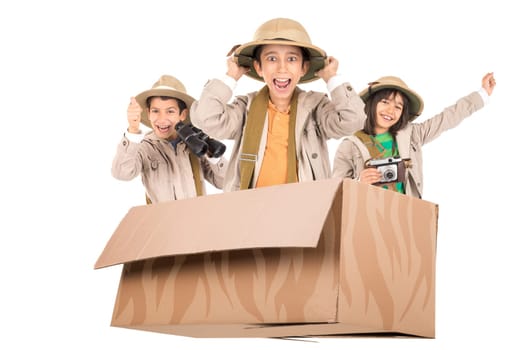 Children in a cardboard box playing Safari