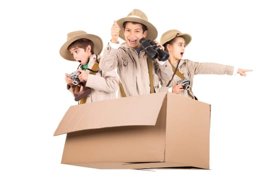 Children in a cardboard box playing Safari