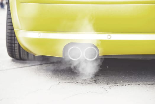 close up on pipe exhaust car smoke emission