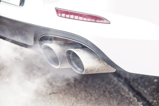 close up on pipe exhaust car smoke emission