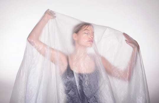 Woman behind foil