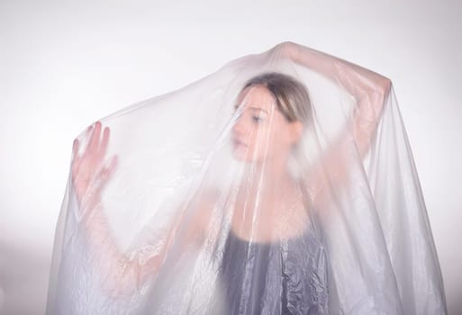 Woman behind foil