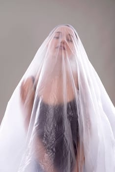 Woman behind foil