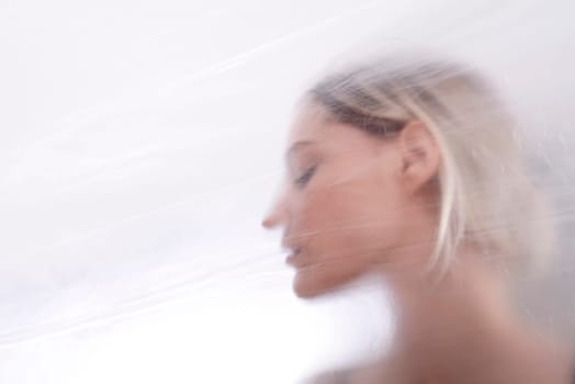 Woman behind foil