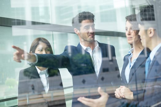 Group of Business people discuss inside office