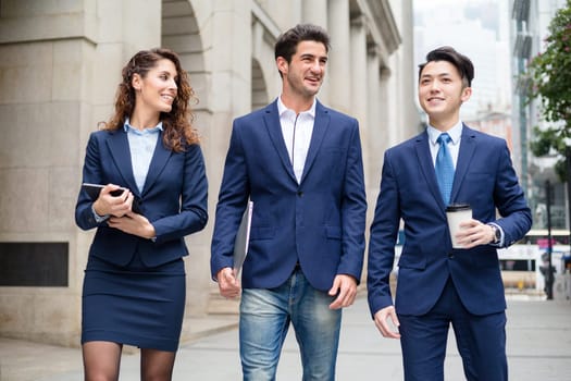 Business team walking outside office