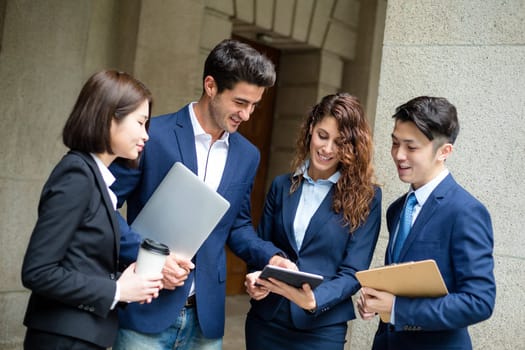 Group of business people working on tablet pc