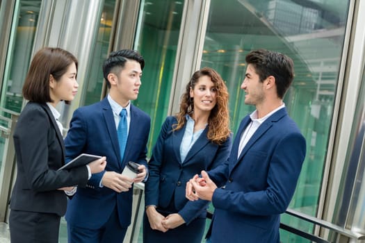 Business team discuss outside office