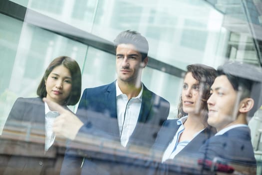 Business people discuss inside office