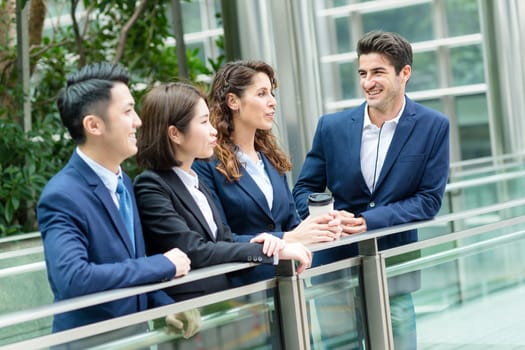 Business people discuss together