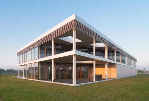modern newly build office building in sunset light