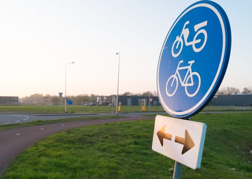 blue traffic sign for bicycles and mopeds, in both directions