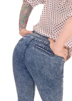 A closeup image of the bottom of a young woman in jeans, bending.forwards, isolated for white background..