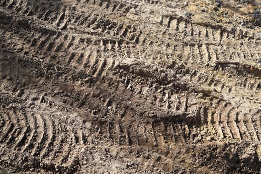 Tire tracks of construction vehicles on a construction site