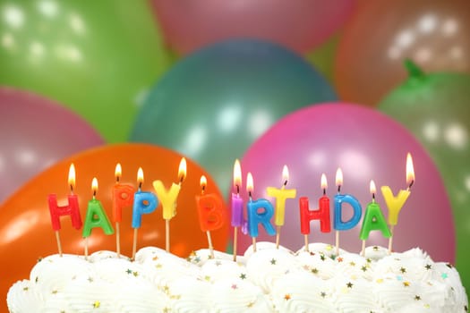 Happy Birthday Celebration with Balloons Candles and Cake