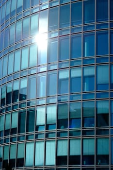 Windows of a glass façade in a high-rise building as a detail
