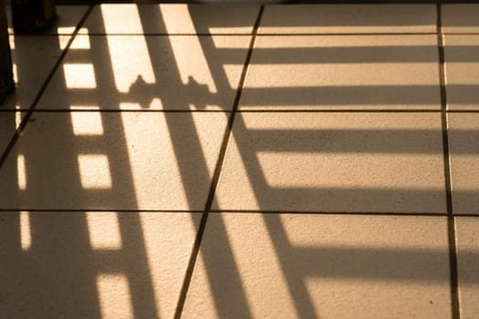 Detail Bakon railing as shade on tiles and joints