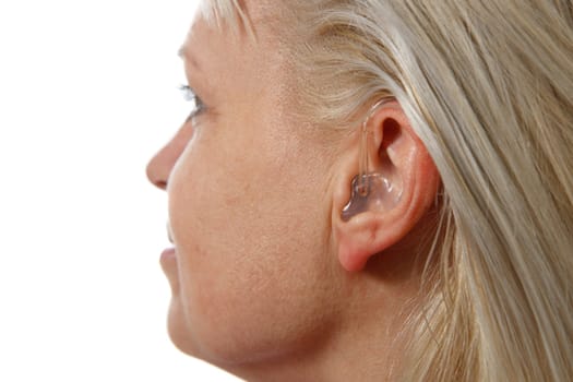 modern digital hearing aid in woman's ear