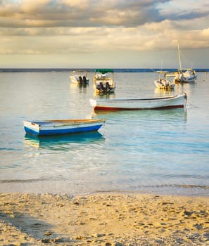 Fishing boats at sunset time.  Mauritius.