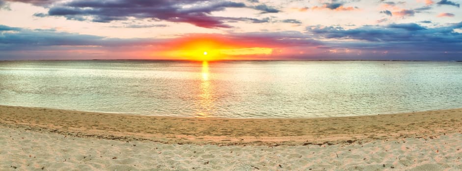 White sandy beach Le Morne at sunset. Mauritius. Panorama