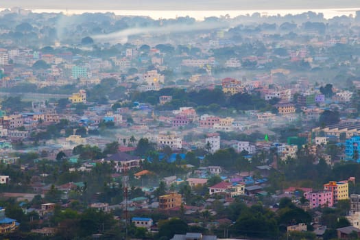 Mandalay with lake mountains, temples and pagodas seen from mandalay hill at sunset, Burma.