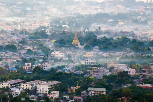 Mandalay with lake mountains, temples and pagodas seen from mandalay hill at sunset, Burma.