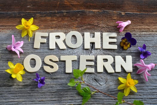 Happy Easter on a wooden background