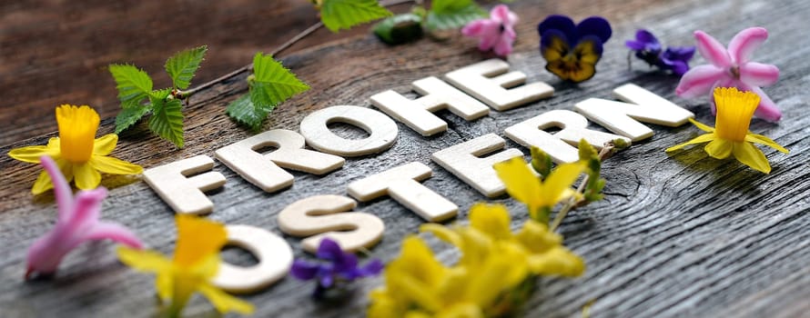 Happy Easter on a wooden background