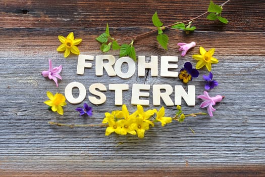 Happy Easter on a wooden background