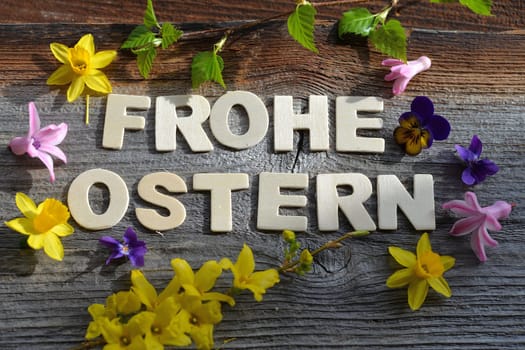 Happy Easter on a wooden background