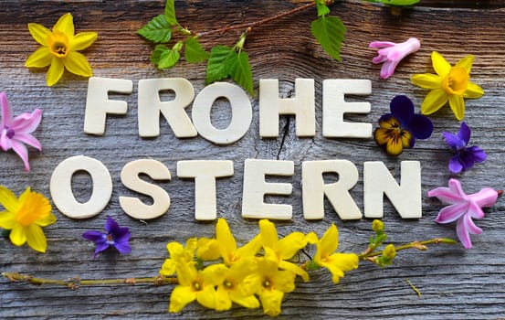 Happy Easter on a wooden background
