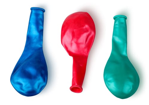 Colorful deflated balloons isolated on white background