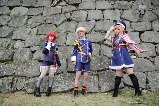 Kagawa, Japan - November 20, 2016: Young japanese girl dressed in cosplay costume at Mamugame-Jou Park. Photo taken in Marugame Cosplay Convention during a meeting of cosplayer.