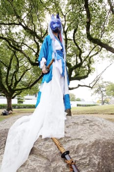 Marugame, Kagawa, Japan - November 20, 2016: Young japanese girl dressed in cosplay costume at Mamugame-Jou Park. Photo taken in Marugame Cosplay Convention during a meeting of cosplayer.