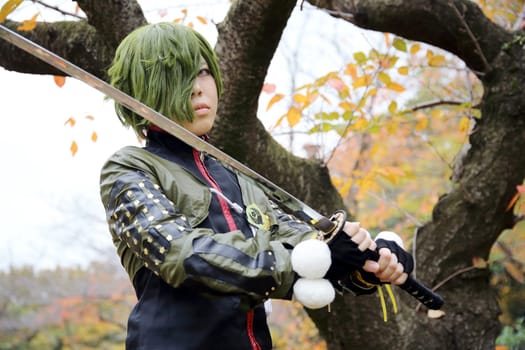 Kagawa, Japan - November 20, 2016: Young japanese girl dressed in cosplay costume at Mamugame-Jou Park. Photo taken in Marugame Cosplay Convention during a meeting of cosplayer.