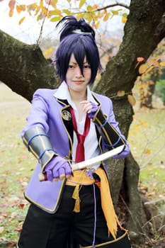 Kagawa, Japan - November 20, 2016: Young japanese girl dressed in cosplay costume at Mamugame-Jou Park. Photo taken in Marugame Cosplay Convention during a meeting of cosplayer.