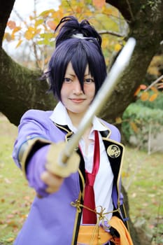 Kagawa, Japan - November 20, 2016: Young japanese girl dressed in cosplay costume at Mamugame-Jou Park. Photo taken in Marugame Cosplay Convention during a meeting of cosplayer.